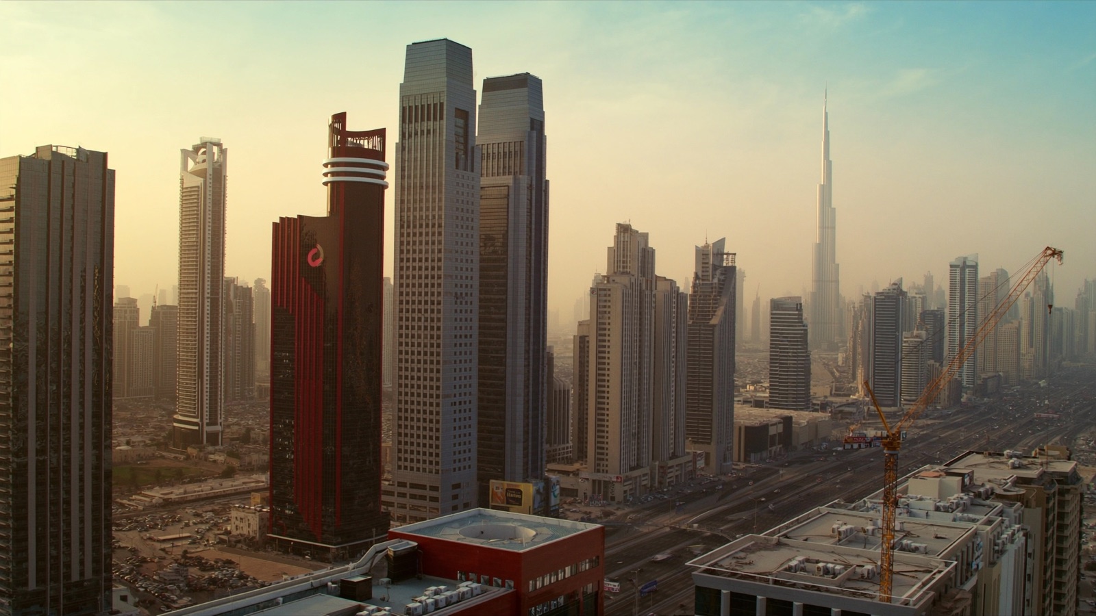 Aerial view of Dubai's business district at golden hour